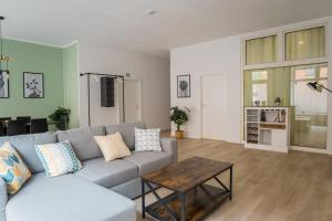 a living room with a couch and a table at Spacious Family Apartment with 2 Bedrooms in Berlin