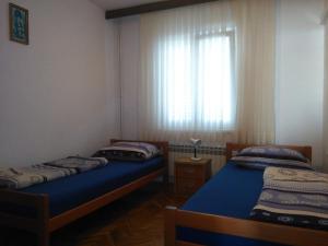 Postel nebo postele na pokoji v ubytování Apartments Silvija