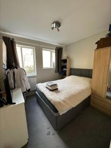 a bedroom with a bed and a window at Central London, Free Parking in London