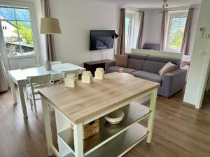 a living room with a table and a couch at Mountain View in Bovec