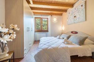 Postel nebo postele na pokoji v ubytování Residence Tatiana B3
