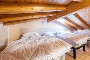 Postel nebo postele na pokoji v ubytování Residence Tatiana B3