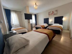 Postel nebo postele na pokoji v ubytování Hotel Yakut