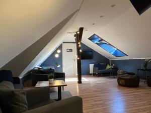 a living room with a skylight in the attic at Blue Doors Hostel Altstadt in Rostock
