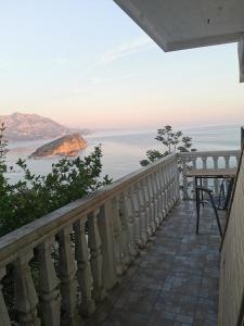 a balcony with a view of the ocean at High Hostel in Budva
