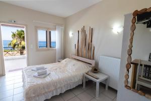 Voodi või voodid majutusasutuse Sea View Suite Methana toas