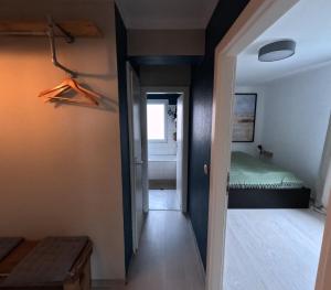 a hallway with a room with a bed and a window at Waterfriends in Timmendorfer Strand