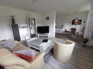 a living room with a couch and a table at Ferienwohnung Am Stadtrand Garz Rügen in Garz