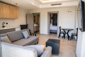 a living room with a couch and a table at ARCADIA of BODRUM in Bodrum City