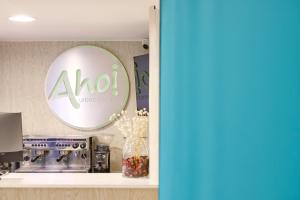 a room with a mirror and a coffee machine at AHOI! Urban Beach in Palma de Mallorca