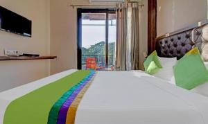 Postel nebo postele na pokoji v ubytování Hotel Green Woods