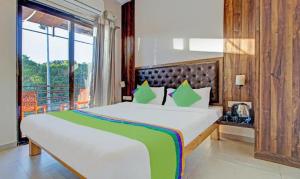 Postel nebo postele na pokoji v ubytování Hotel Green Woods