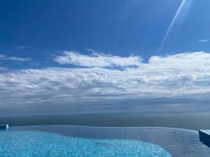 a view of the ocean from a swimming pool at VILLAS GOLF in Balchik
