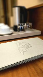 a sign on top of a counter next to a stove at Parc Hotel in Poppi