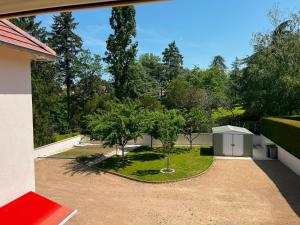 a view of a garden from the outside of a house at Emporium Néris - Premium Serviced Apartments in Néris-les-Bains