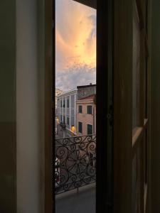 an open door with a view of a balcony at Elisabetta1 Guesthouse Sassari in Sassari