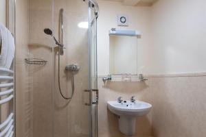 a bathroom with a sink and a shower at The Warehouse in Yeovil