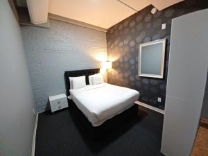 Ένα ή περισσότερα κρεβάτια σε δωμάτιο στο Enjoy Spring Time In Boston 406