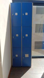a group of blue lockers in a room at Albergue Camino Santiago Porriño - En Pleno Centro - City Centre in Porriño