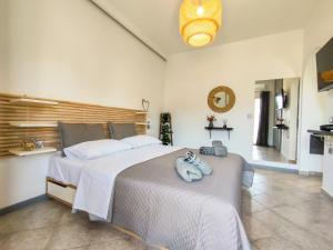 Postel nebo postele na pokoji v ubytování Athos Studio