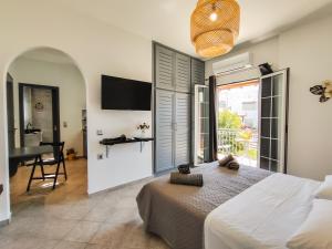 TV a/nebo společenská místnost v ubytování Athos Studio