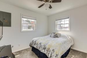 a white bedroom with a bed and two windows at Atlantic City Home with Gas Grill Near 8 Beaches! in Atlantic City