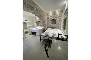 a bathroom with two sinks and two toilets at Politimis Studio N6 in Amorgos