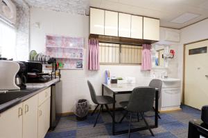 a kitchen with a table and chairs in it at Tokyo Shinjuku hotel in Tokyo