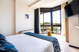 Кровать или кровати в номере Hotel Ristorante Al Fiore