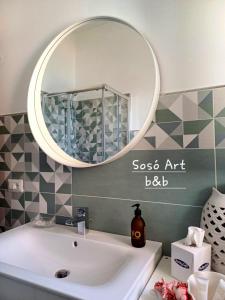a bathroom with a sink and a mirror at Sosò Art b&b in Positano +28 photos