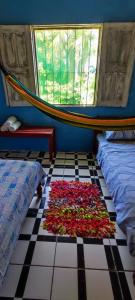 En eller flere senge i et værelse på Eco Hostel Lunar