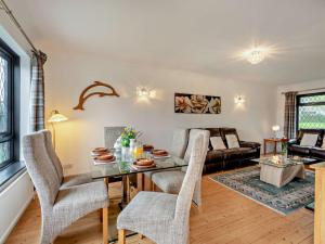 a living room with a table and chairs at 3 Bed in West Mersea 94316 in West Mersea