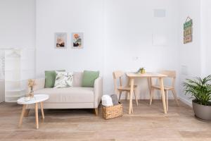 a living room with a couch and a table at La Lajita Barca Beach Sand in La Lajita