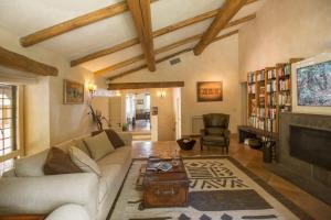a living room with a couch and a fireplace at Villaflair - Sea View Porto Ercole in Porto Ercole
