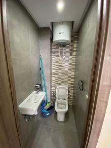 a small bathroom with a sink and a toilet at Smir Park,Tetouan in Marina Smir