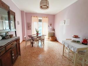 a kitchen with a table and chairs and a dining room at Affittacamere San Rocco in Aramengo +30 photos