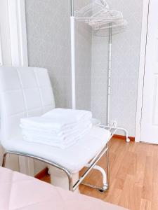 a white dental chair in a room with a mirror at Expe Finland in Porvoo