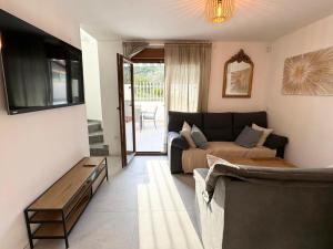 a living room with a couch and a table at Amber Holiday Home in Peniscola