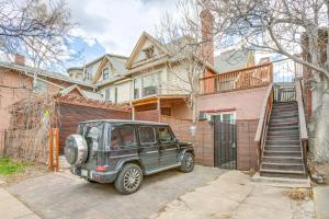 a green jeep parked in front of a house at Denver Tiny House Walk to Cafes, Bars, Eateries! in Denver