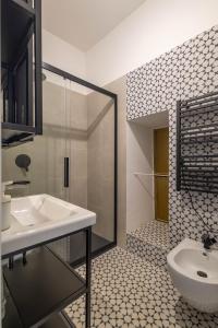 a bathroom with a sink and a glass shower at U Paradis - Appartamento - Vicino Bari in Valenzano +64 photos