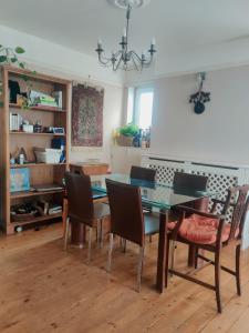 a dining room with a table and chairs at Headington Haven Homestay in Oxford