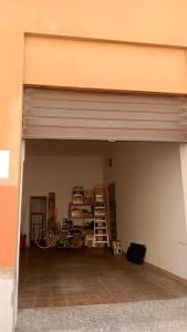 a garage with a bike parked inside of it at Via Verdi Apartment in Imola
