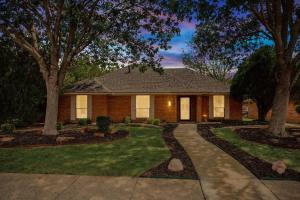 a house with a yard with trees and a driveway at Allen Abode - 4 Bedrm Pool Fire Pit Charm in Allen