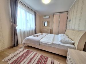 Posteľ alebo postele v izbe v ubytovaní Dacha Koncha Zaspa