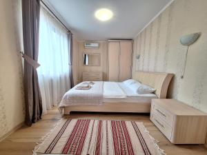 Posteľ alebo postele v izbe v ubytovaní Dacha Koncha Zaspa