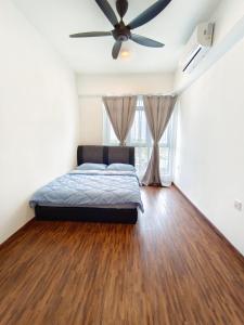a bedroom with a bed and a ceiling fan at K-Avenue JANNATH269 HOMESTAY KKIA KK in Donggongon