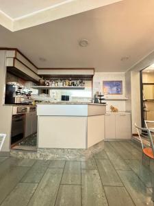 a kitchen with a large white counter top in a room at Hotel Le Querce in Milan