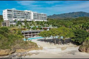 an aerial view of a resort with a beach at Spectacular Ocean front 5BR condo in Bolongo in Punta Mita