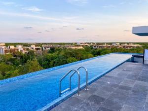 La pileta dentro o cerca de Excellent Studio in Aldea Zama with Pool, Gym, Wifi