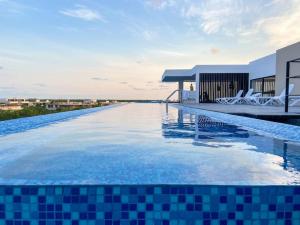 La pileta dentro o cerca de Excellent Studio in Aldea Zama with Pool, Gym, Wifi